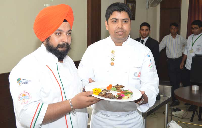 Chef-Jaswinder-and-Chef-Sunil-Arya-with-Black-Chicken-preparation