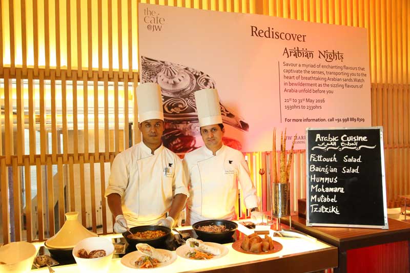 L-R--Chef-Debashish-Biswas-and-Chef-Vijay-Prakash-displaying-food-to-be-served-at-Arabian-Nights,-Arabian-Food-festival-at-JW-Marriott-Chandigarh