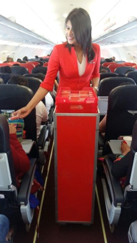 Cabin Crew distributing chocholates to guests on board AirAsia India flights (Small)