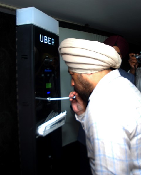 IG Police of Chandigarh Mr.TS Luthra taking the Uber Breathalyser test at the launch (Small)