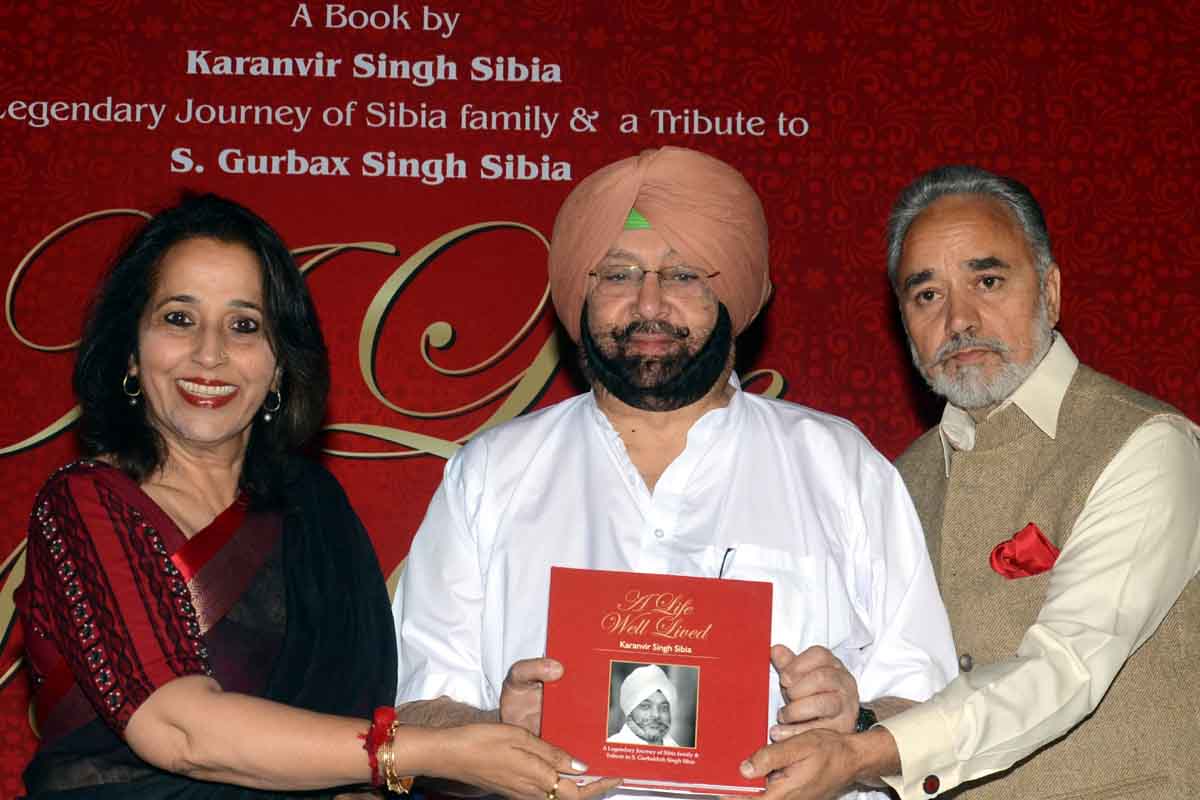 Capt Amarinder Singh releasing the book by Karanvir Singh Sibia (right) with Bittu Sandhu (left)